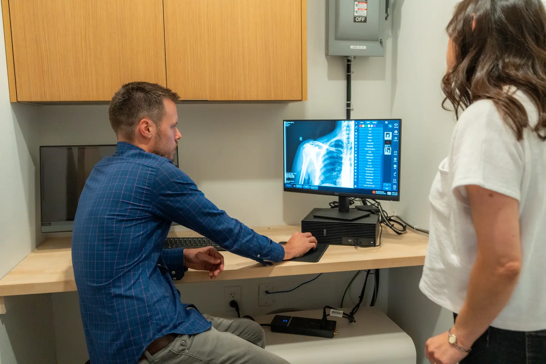 Dr. Michael Moss reviewing imaging after an auto injury